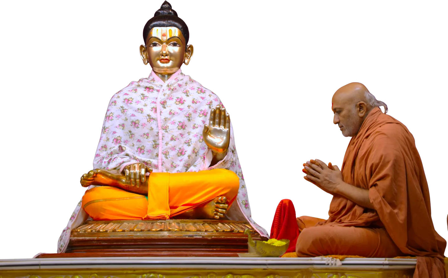 Sadguru Shri Dharmavallabhdasji Swami in prayer before Shri Nilkanth Varni during abhishek