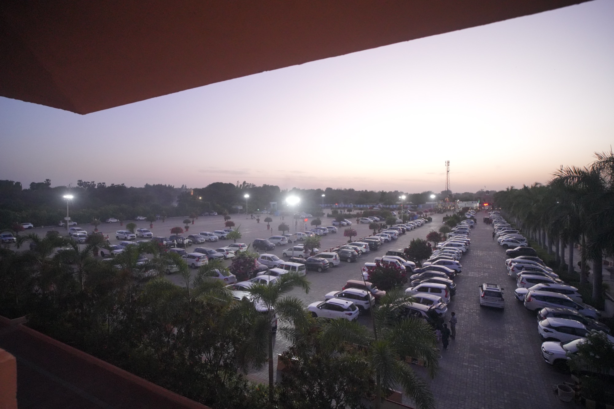 Marked visitor parking area near Swagatam at Nilkanthdham
