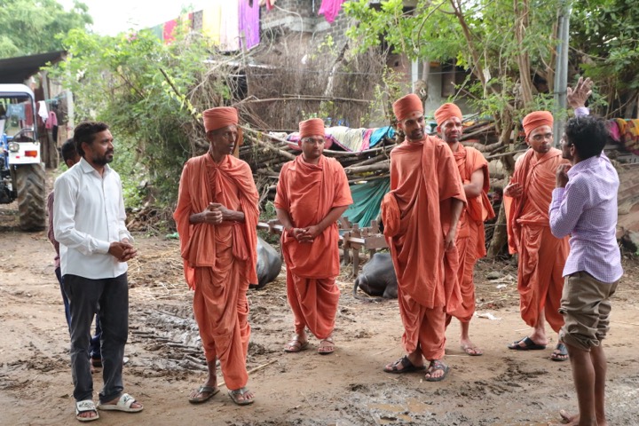 Sants walking through a nearby village during Sadavrat support seva